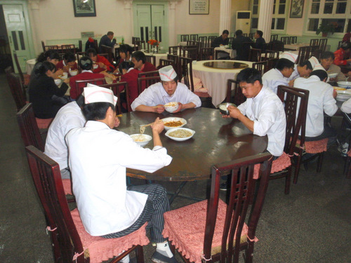 Restaurant Staff eats a meal just before closing.